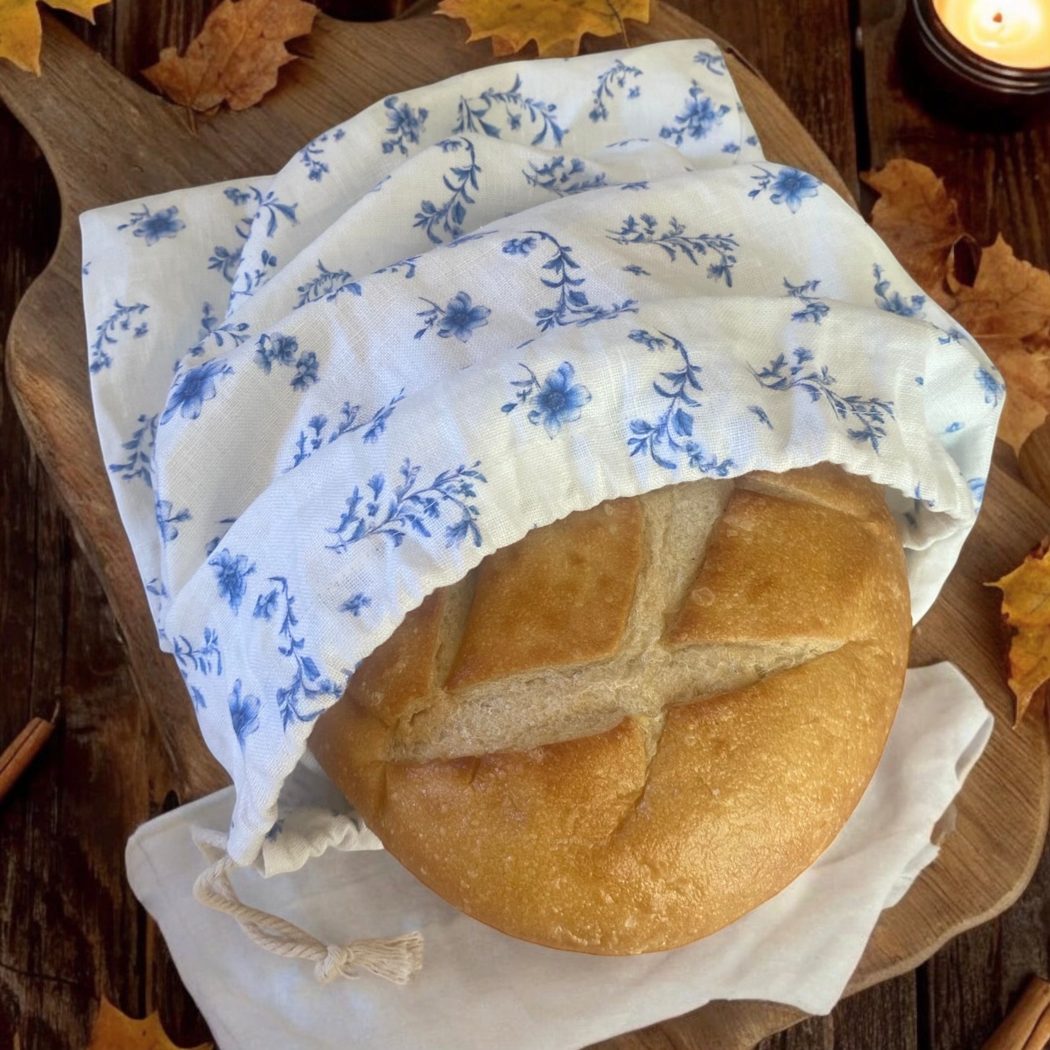 Floral French Linen bread bag in a rustic fall kitchen setting, perfect for storing homemade bread during autumn